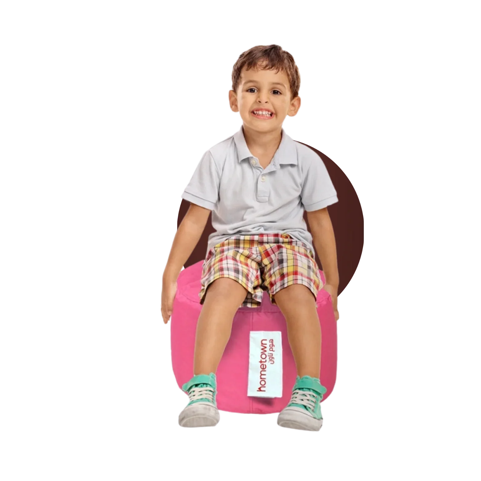 Child sitting on modern pink pouf seat, showing contemporary home furniture design