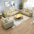Modern living room with beige sofas, wooden table, and decorative cushions, expert home furniture design.