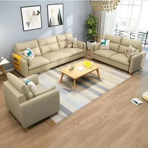 Modern living room with beige sofas, wooden table, and decorative cushions, expert home furniture design.